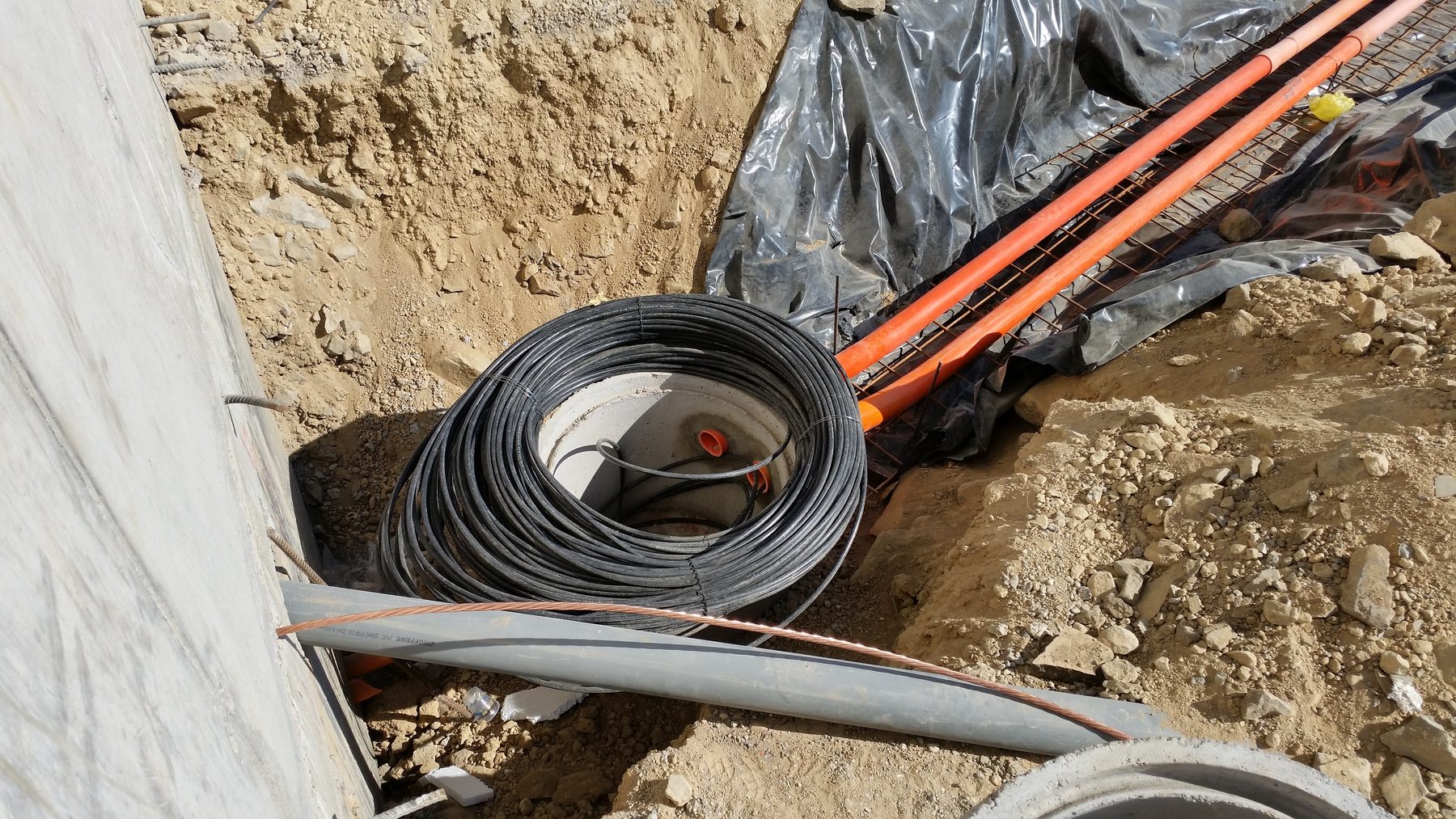Field team installing fibre-optic cable during a live infrastructure project